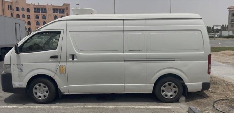 Toyota Hiace chiller van for rent in Dubai with a roof-mounted refrigeration unit