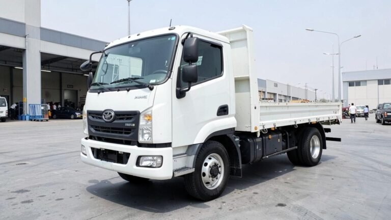 White 3-tonne drop-side pickup for rent in Dubai, front three-quarter view