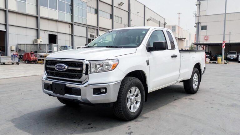 White 1-ton pickup for rent in Dubai, front three-quarter view