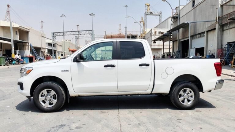 1-ton pickup side profile, showing the full length of the open drop-side bed