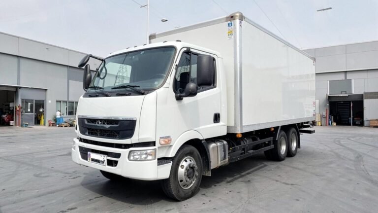 White 10-tonne box truck for rent in Dubai, front three-quarter view